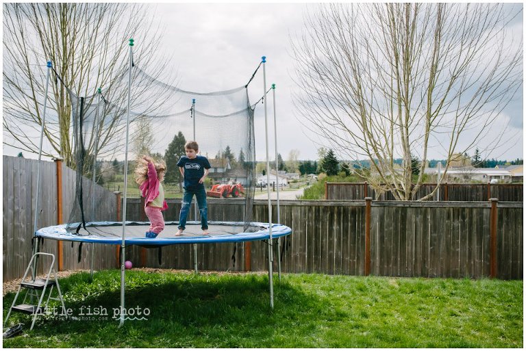 brother and sister on trampoline - day in the life  photography