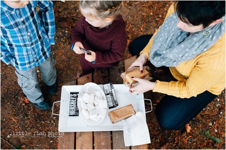 Family with tray of s'mores ingredients