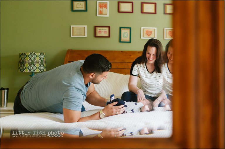 reflection of family in bed with sleepy baby - Poulsbo Lifestyle Newborn Photographer