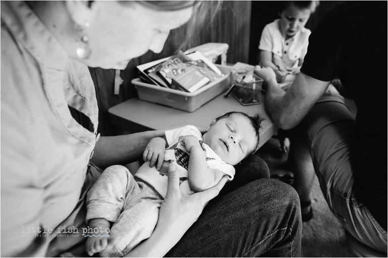 newborn sleeps while brother colors - Poulsbo Documentary Family Photographer