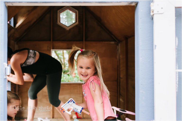 girl with nerf gun in playhouse - Poulsbo Lifestyle & Documentary Family Photograher